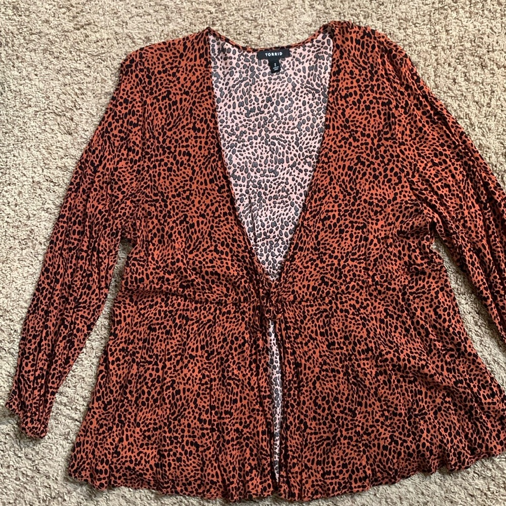 Women’s cheetah print top. Long sleeve with tie in the front. Torrid size 2